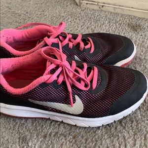 This is a pink and black tennis shoes